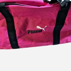 Cute and sporty Puma pink gym bag with sturdy black straps